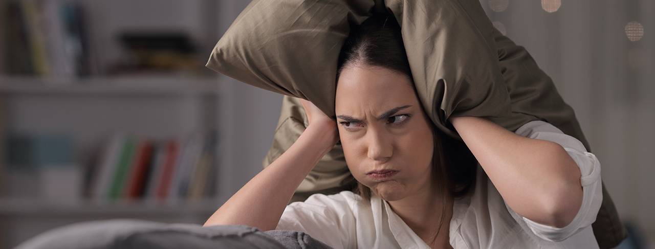 Angry,Homeowner,Suffering,Neighbor,Noise,Covering,Ears,Sitting,On,A